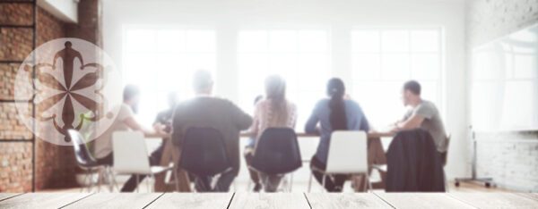 People sitting in conference room doing research