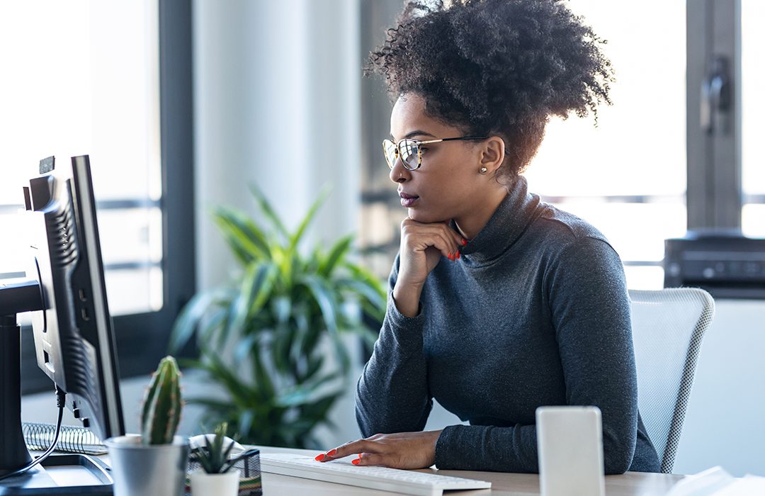 woman doing research on computer