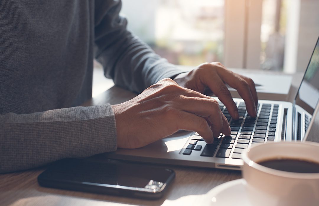 person typing on computer