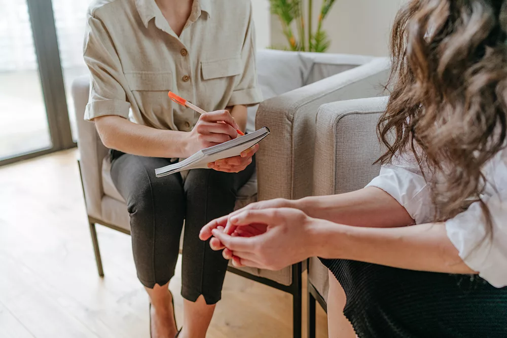 person meeting with counselor