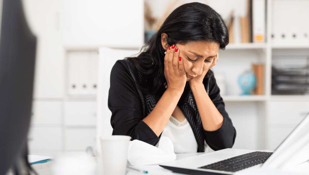 woman having depressive episode at work