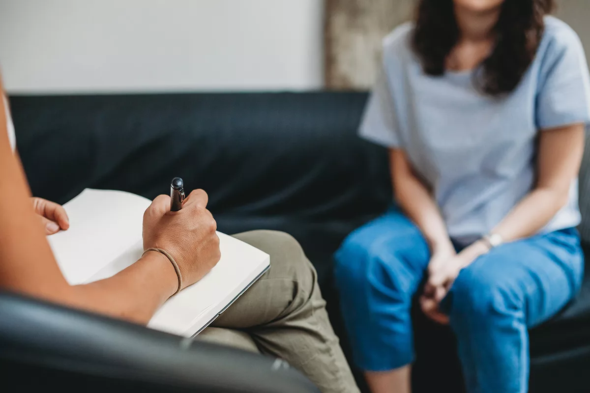 close up of therapist talking with client