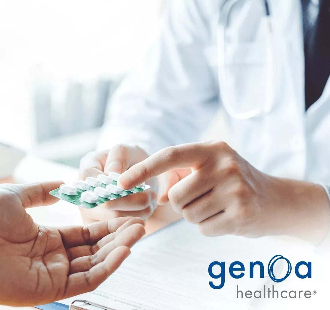 doctor giving patient medication with genoa healthcare logo on top