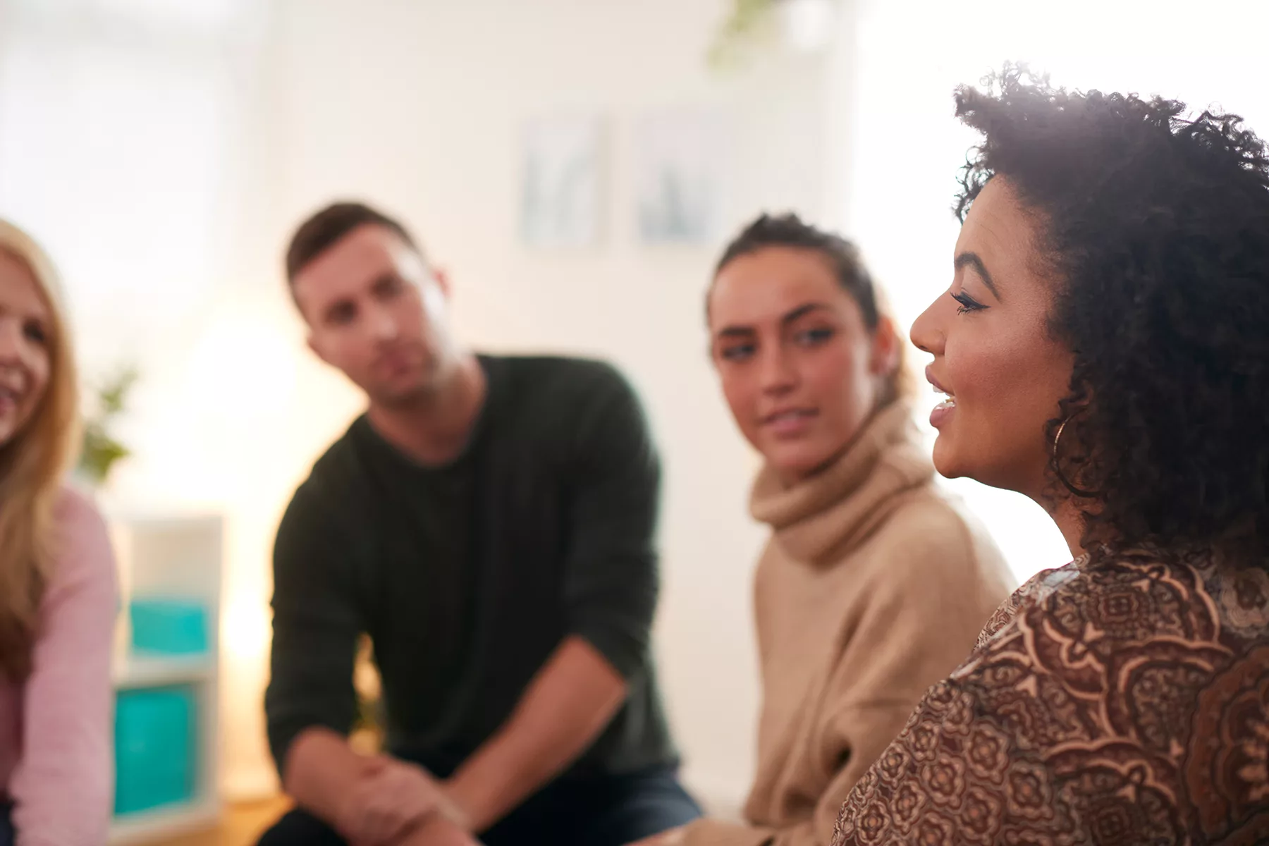 group of people talking in therapy