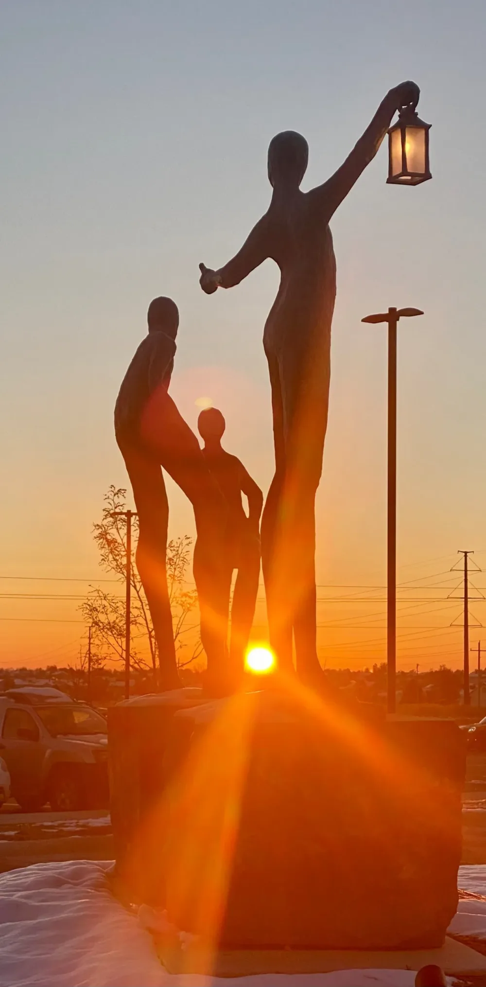 "The Journey" bronze sculpture at the entrance of the Acute Care facility radiates hope at sunrise.
