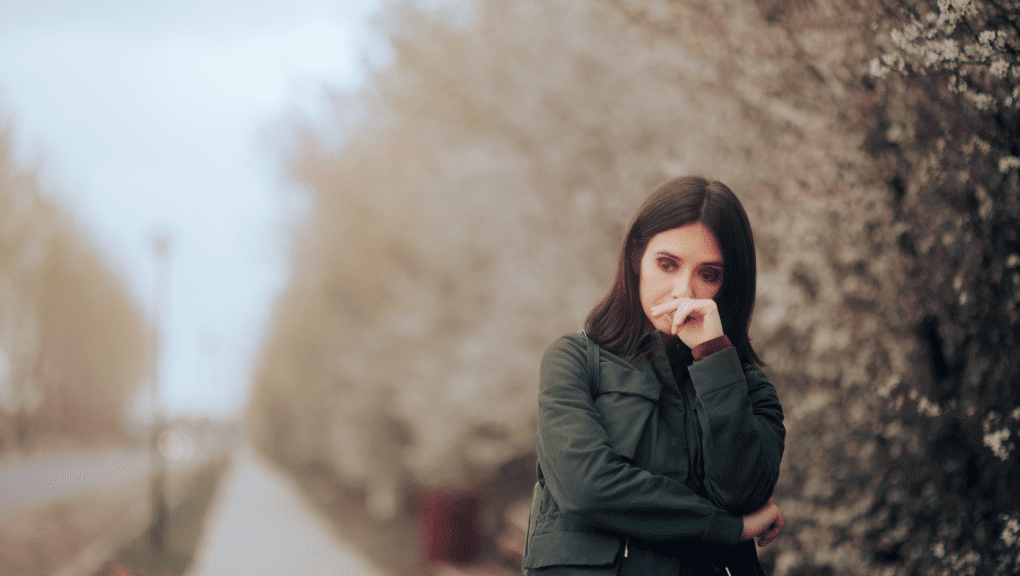 Lone woman outside during fall.